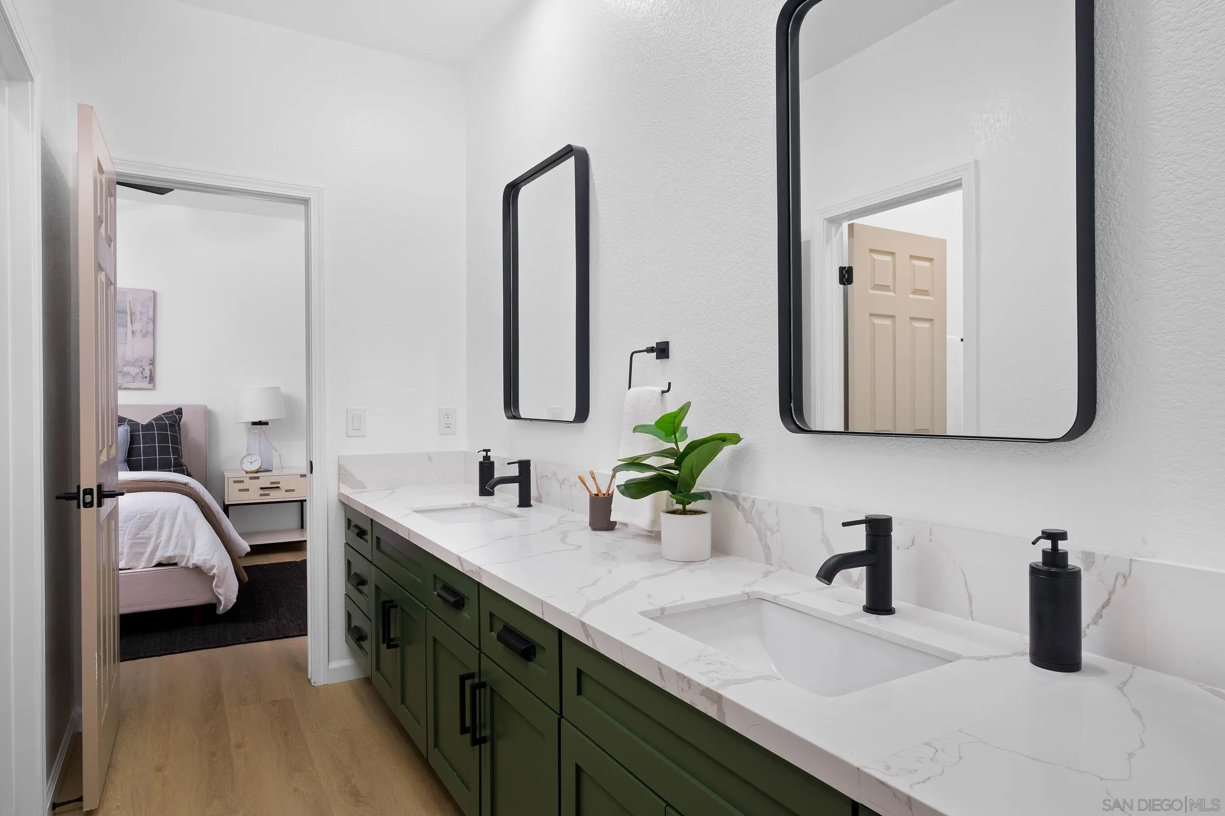 550 Echo Lane San Marcos, CA 92078 - Photo 24 of 51 a bathroom with a double vanity sink and a mirror