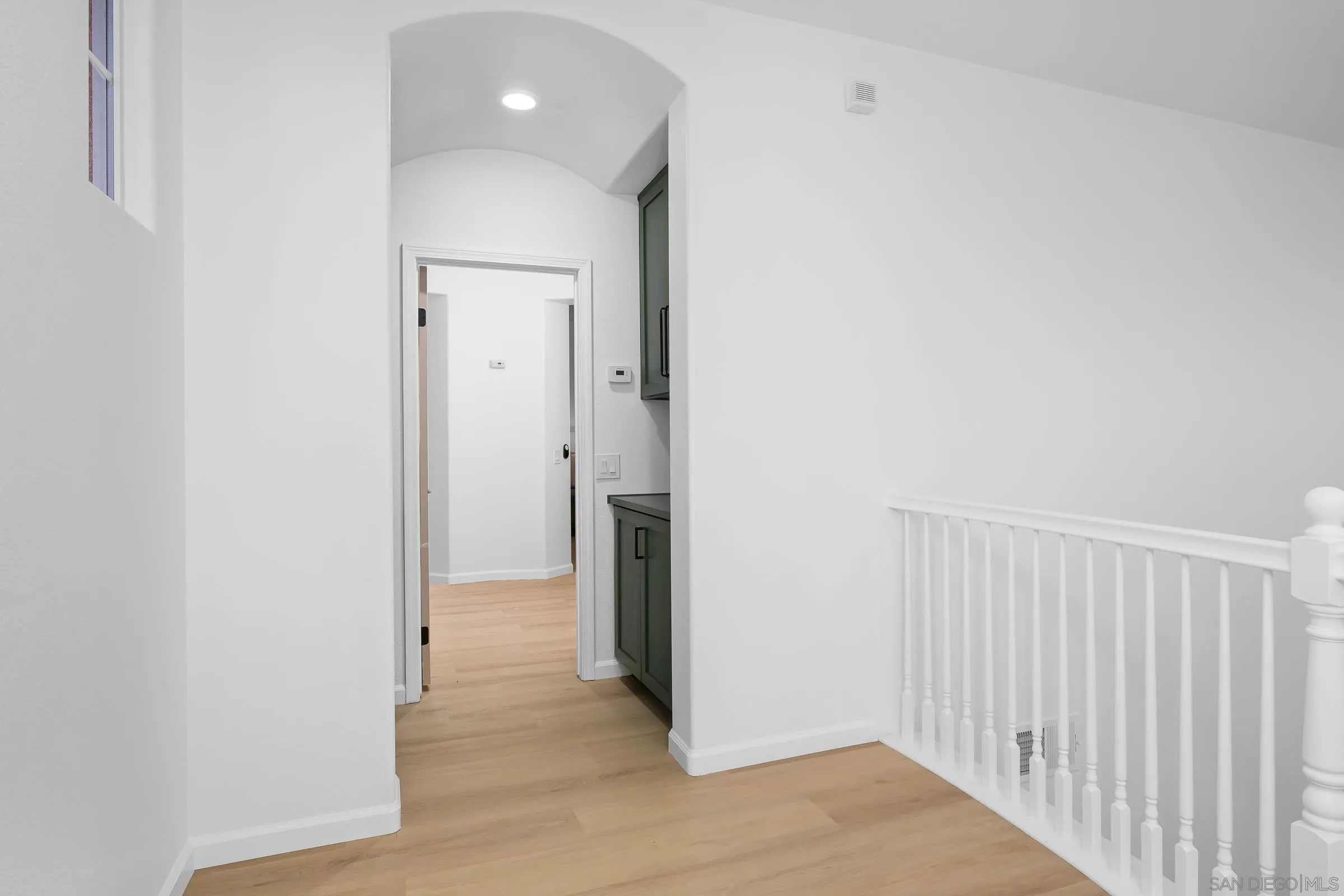 550 Echo Lane San Marcos, CA 92078 - Photo 26 of 51 a view of a hallway with wooden floor
