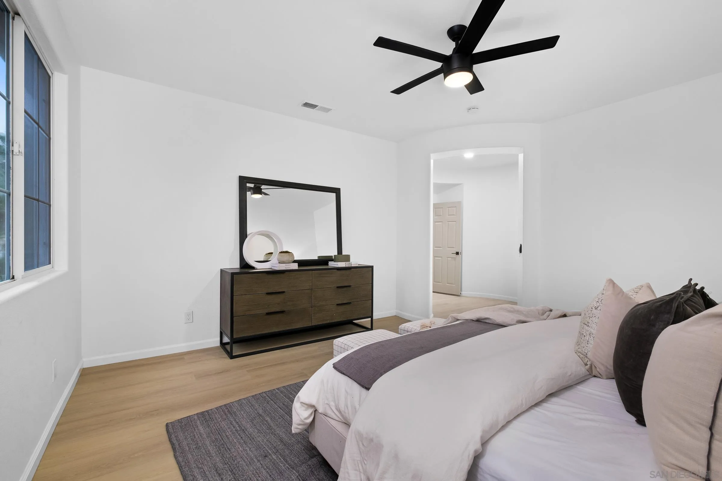 550 Echo Lane San Marcos, CA 92078 - Photo 28 of 51 a bedroom with a bed and a dresser