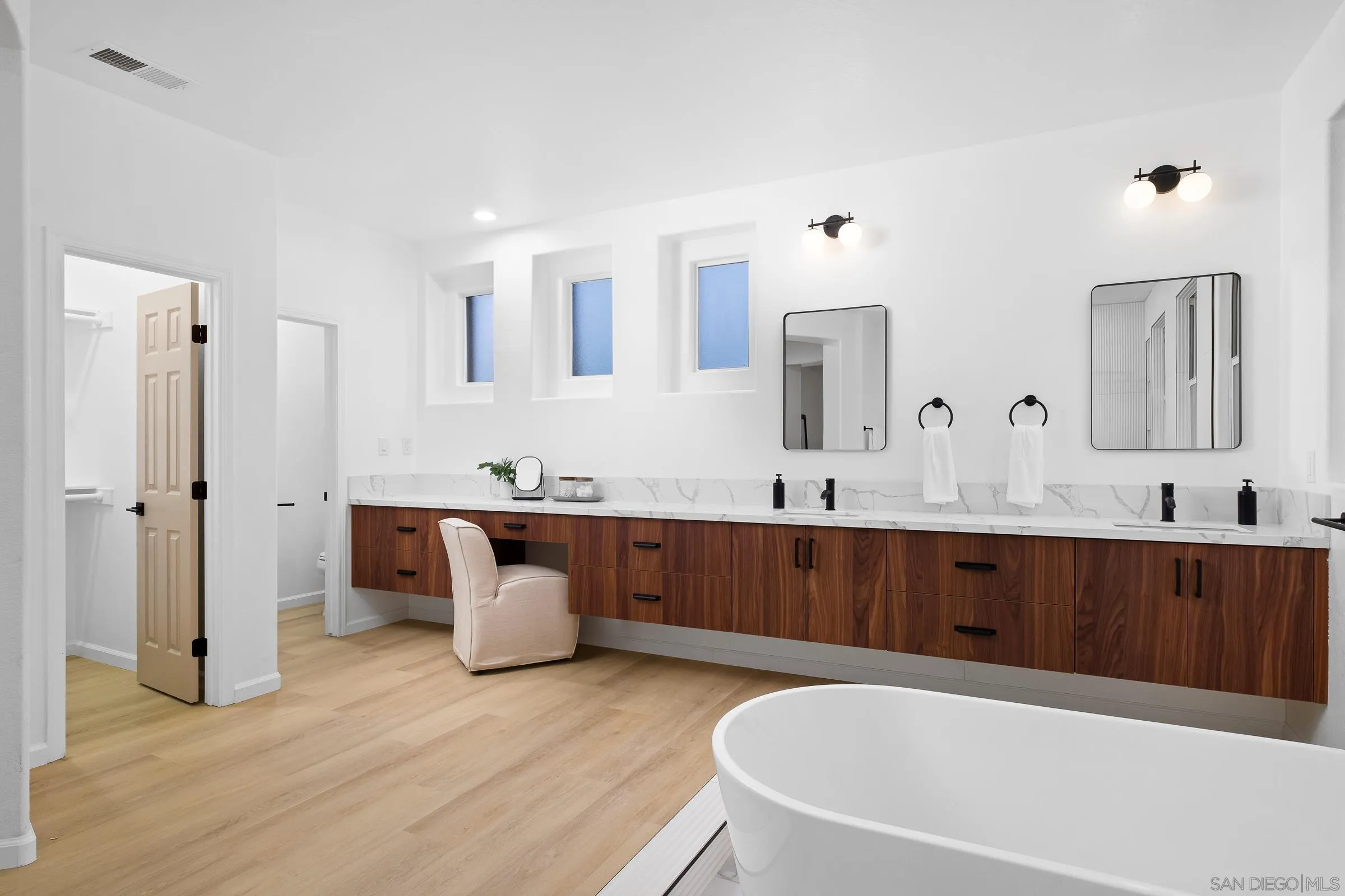 550 Echo Lane San Marcos, CA 92078 - Photo 32 of 51 a spacious bathroom with a tub double sink and mirror