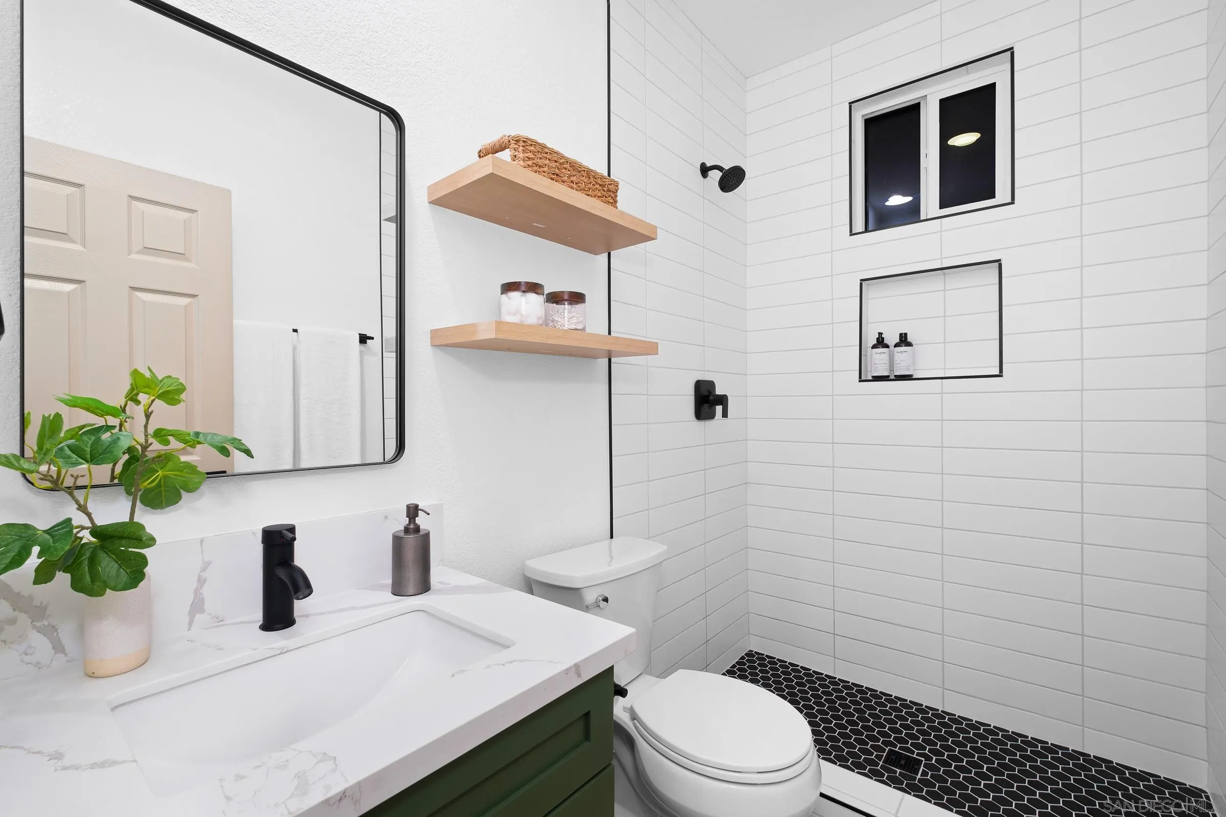 550 Echo Lane San Marcos, CA 92078 - Photo 38 of 51 a bathroom with a sink a toilet and shower