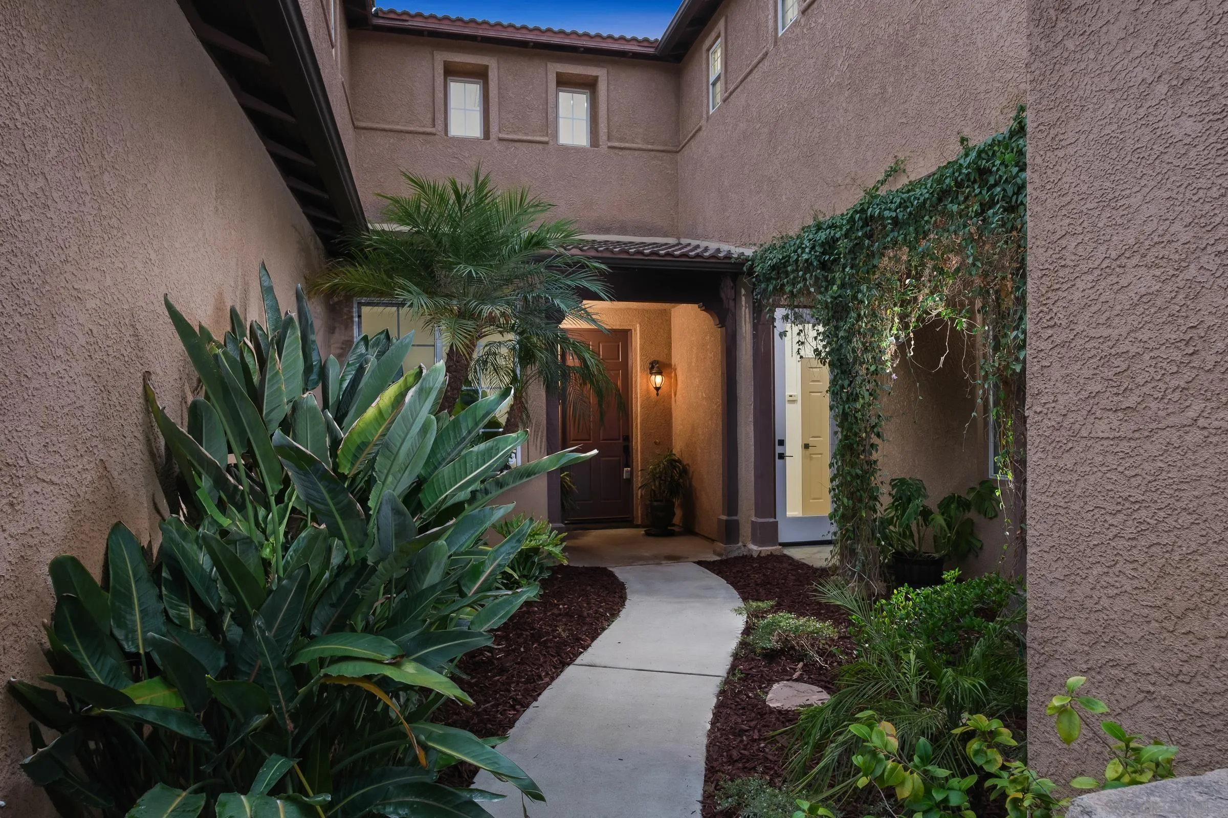 550 Echo Lane San Marcos, CA 92078 - Photo 7 of 51 a couple of potted plants in front of door