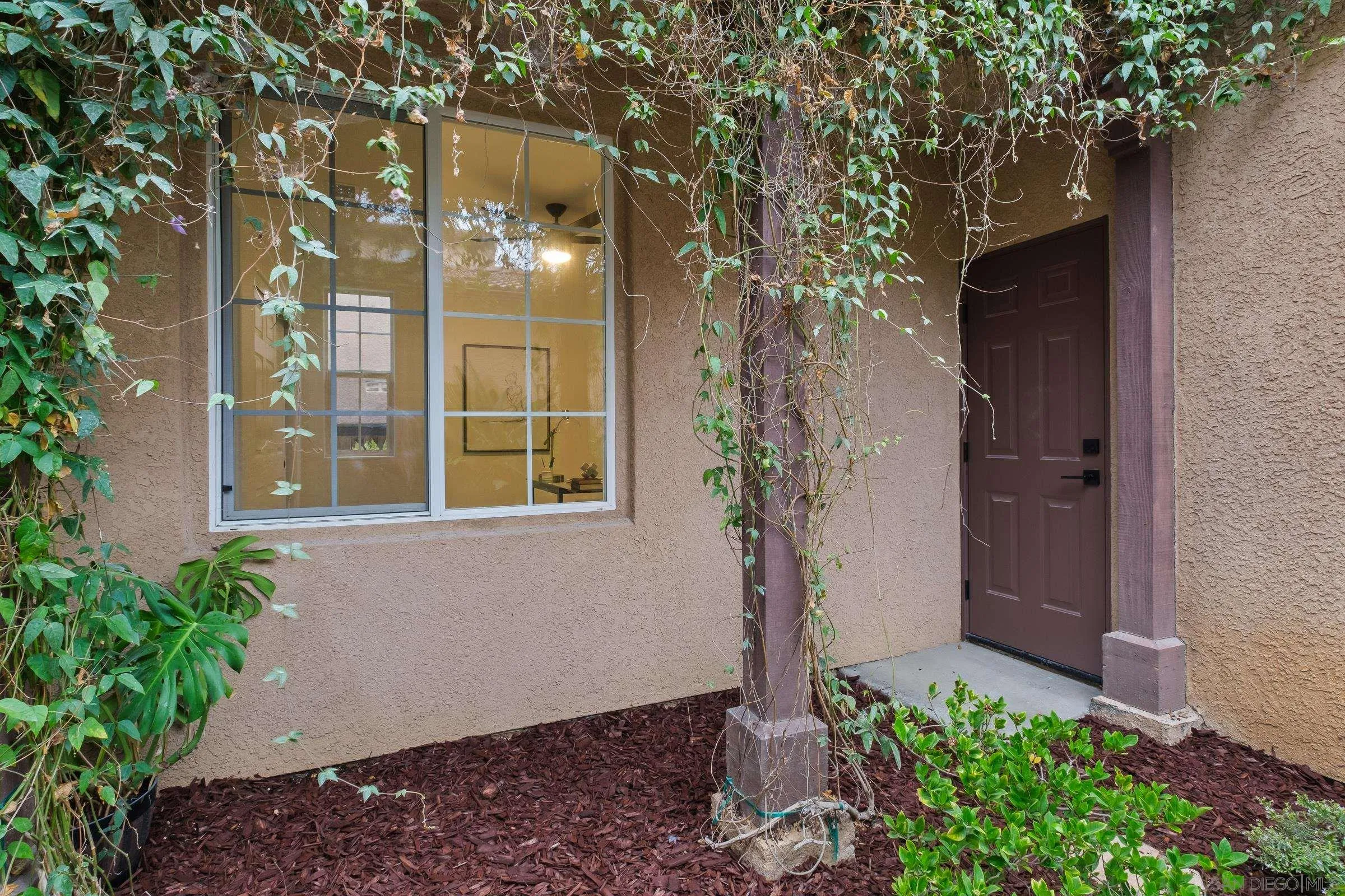 550 Echo Lane San Marcos, CA 92078 - Photo 8 of 51 a view of a house with a tree