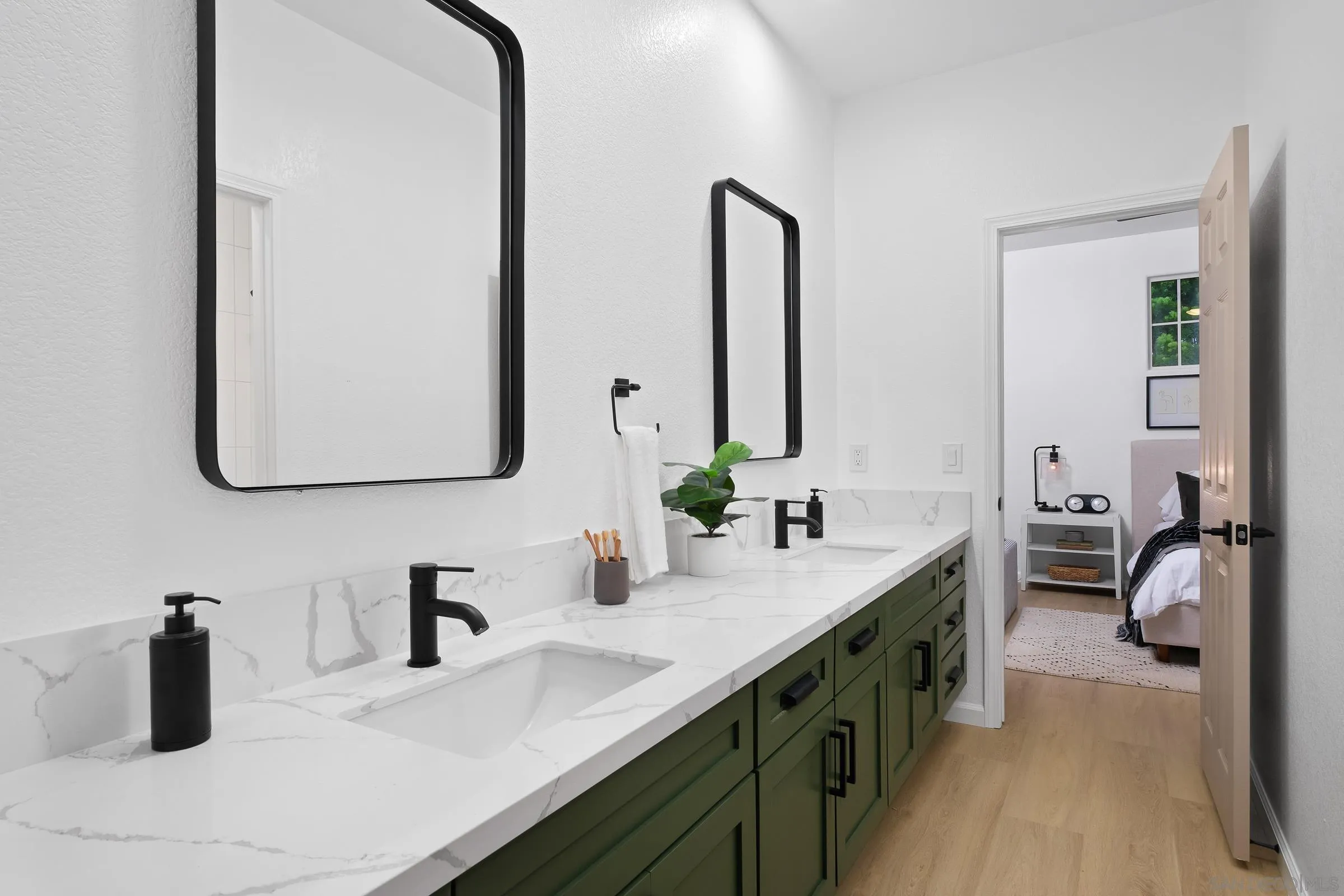 550 Echo Lane San Marcos, CA 92078 - Photo 10 of 51 a bathroom with a double vanity sink and a mirror