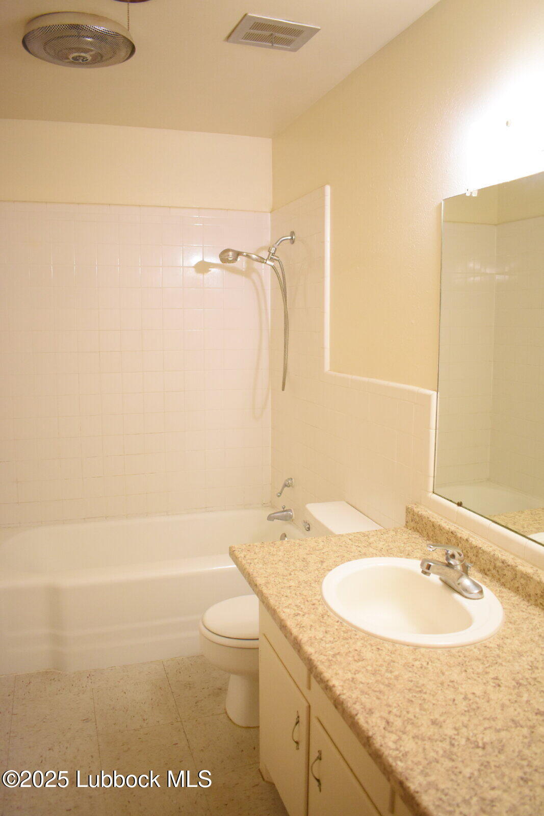 2008 54th Street Lubbock, TX 79412 - Photo 11 of 14 a bathroom with a sink a toilet and shower