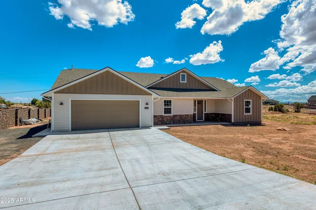 a front view of a house with yard