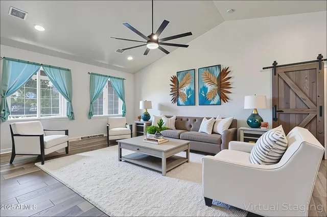 a living room with furniture and a large window