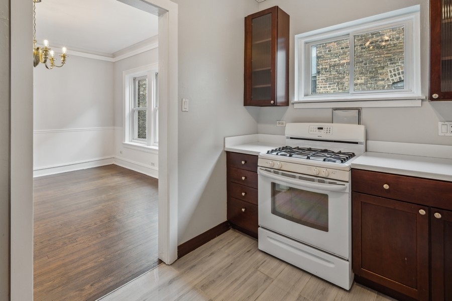 534 West Brompton Avenue, Unit 3N Chicago, IL 60657 - Photo 11 of 19 a kitchen with a stove and a window