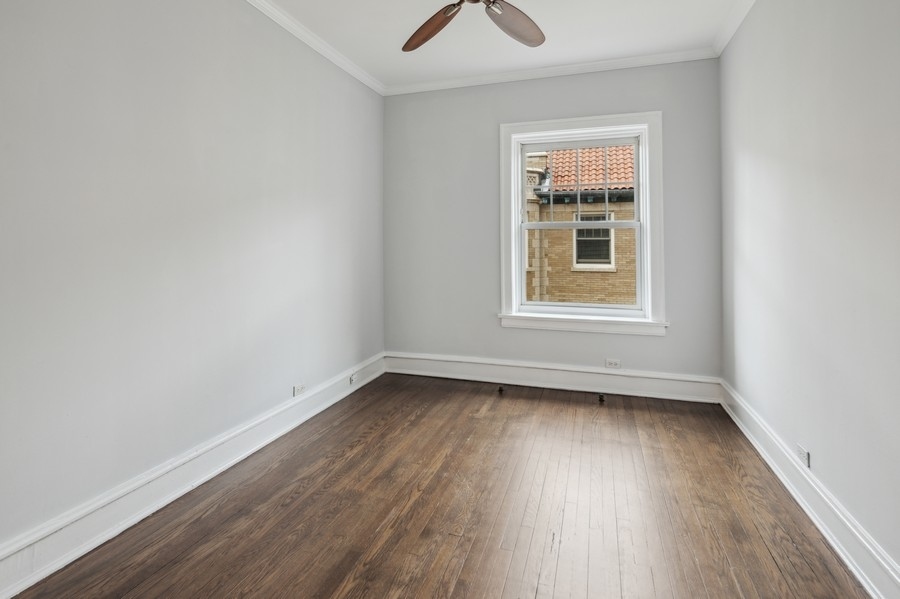 534 West Brompton Avenue, Unit 3N Chicago, IL 60657 - Photo 12 of 19 wooden floor and window in an empty room