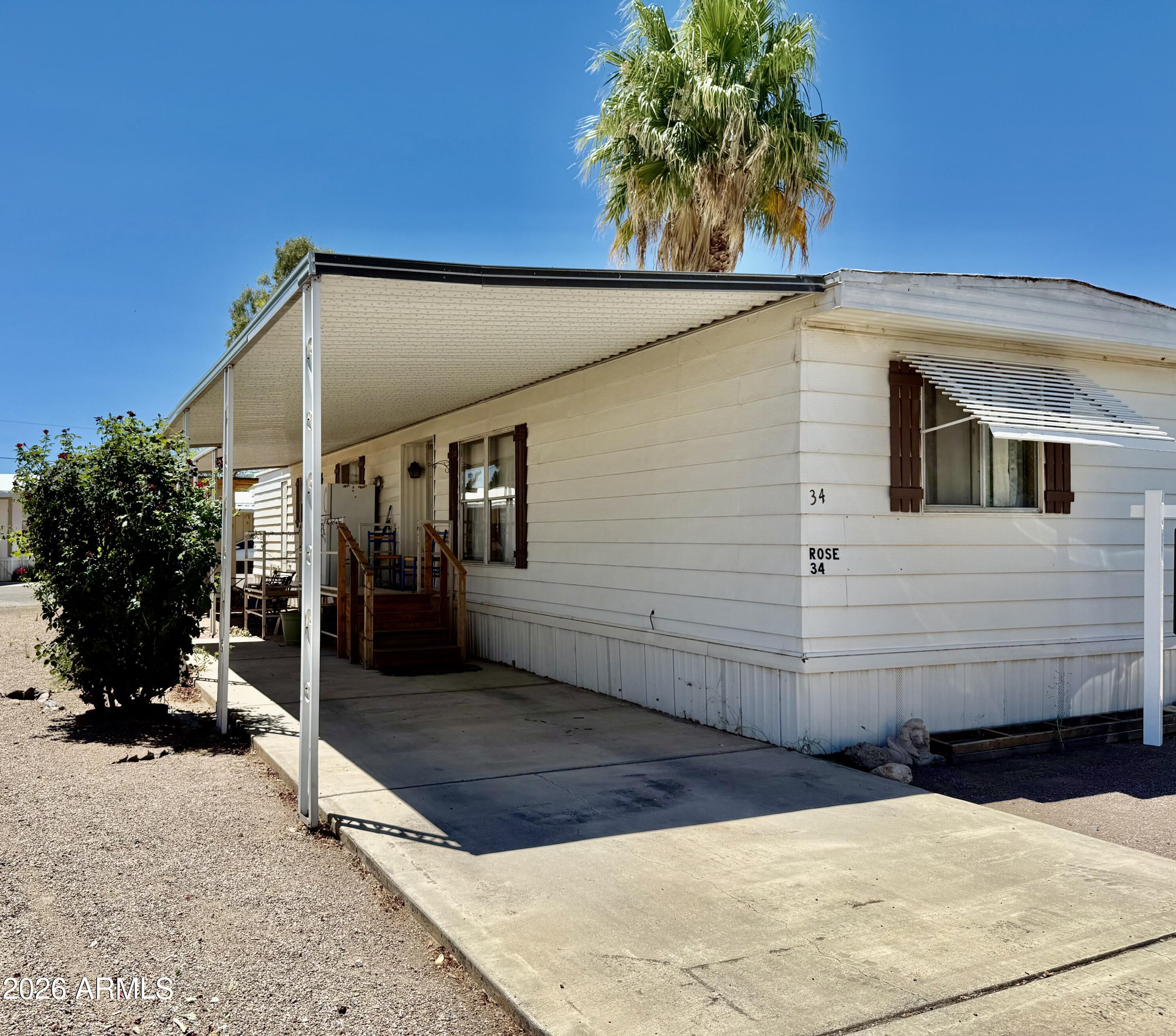 300 Airport Road, Unit 34 Kearny, AZ 85137 - Photo 1 of 18 a view of a house with a backyard