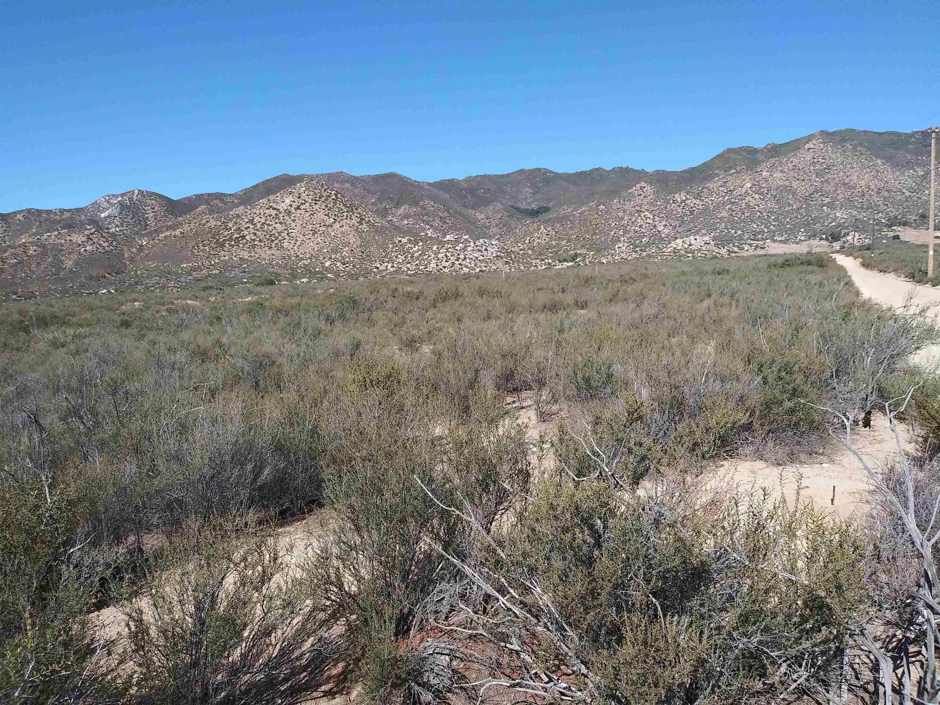 0 Montezuma Valley Road, Unit 1961002400 Ranchita, CA 92066 - Photo 3 of 5 a view of a mountain range in a cloudy sky