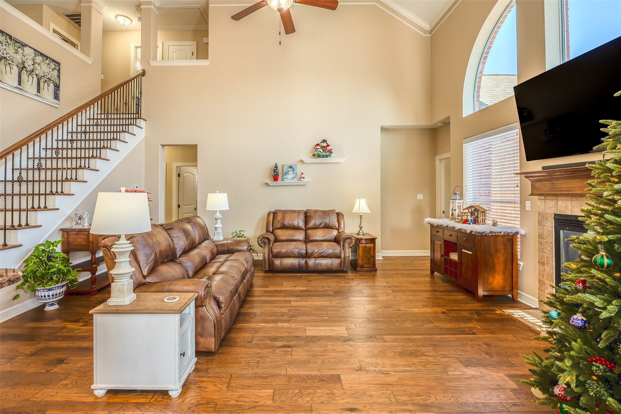 1905 Rosenbaum Drive Brenham, TX 77833 - Photo 12 of 30 a living room with fireplace furniture and a flat screen tv