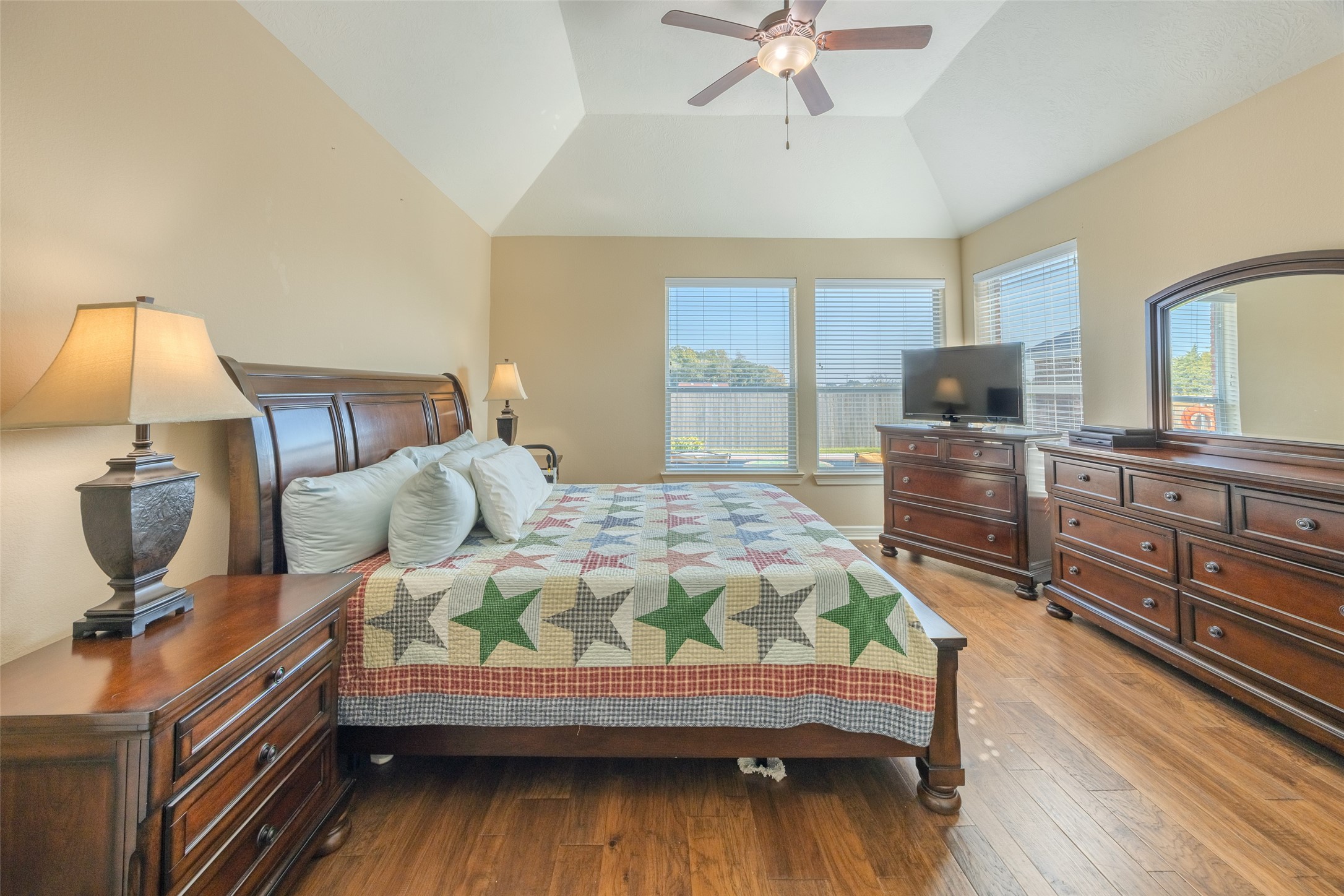 1905 Rosenbaum Drive Brenham, TX 77833 - Photo 18 of 30 a bedroom with a bed and wooden floor