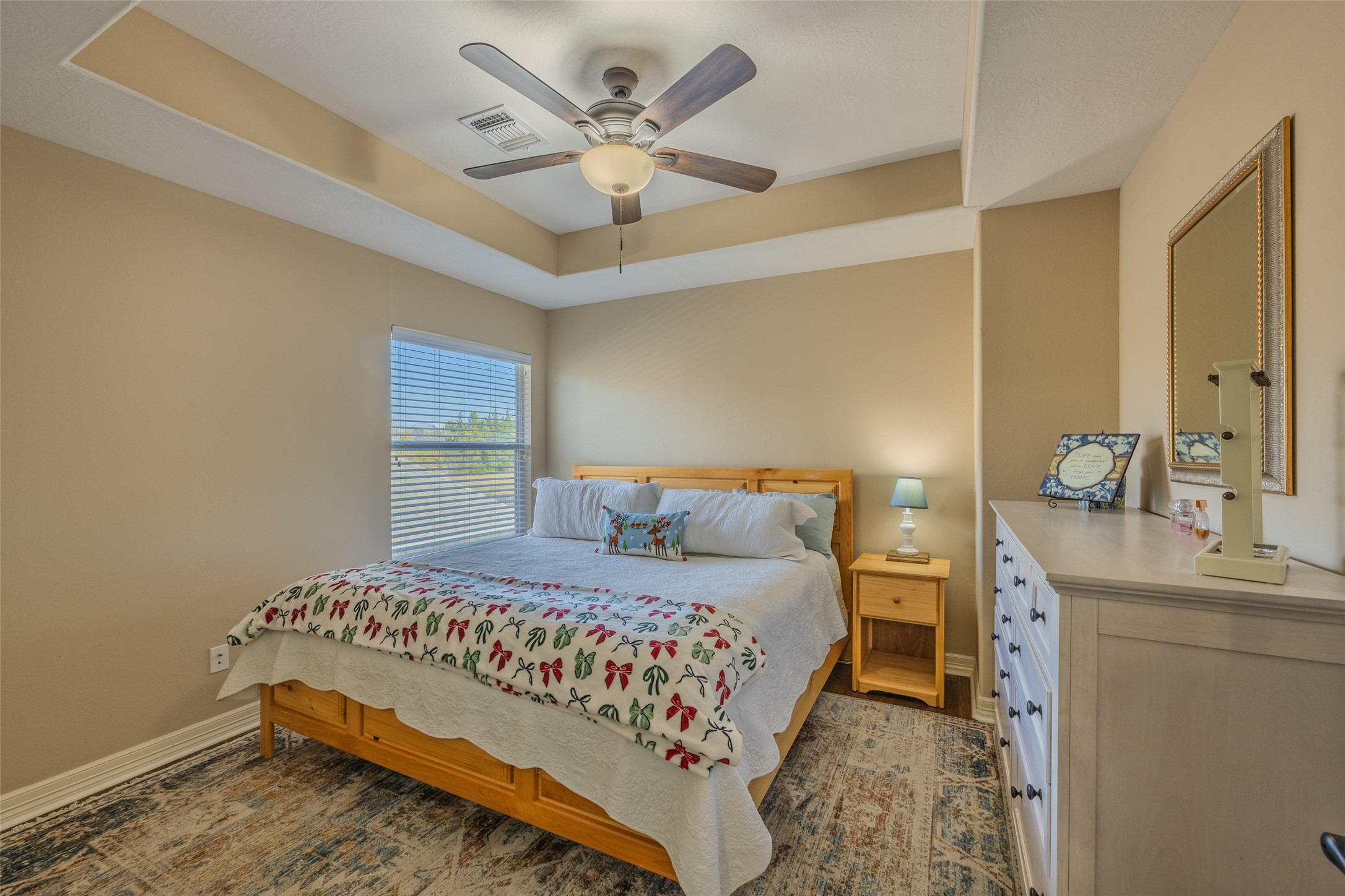 1905 Rosenbaum Drive Brenham, TX 77833 - Photo 23 of 30 a bedroom with a bed chandelier and a window
