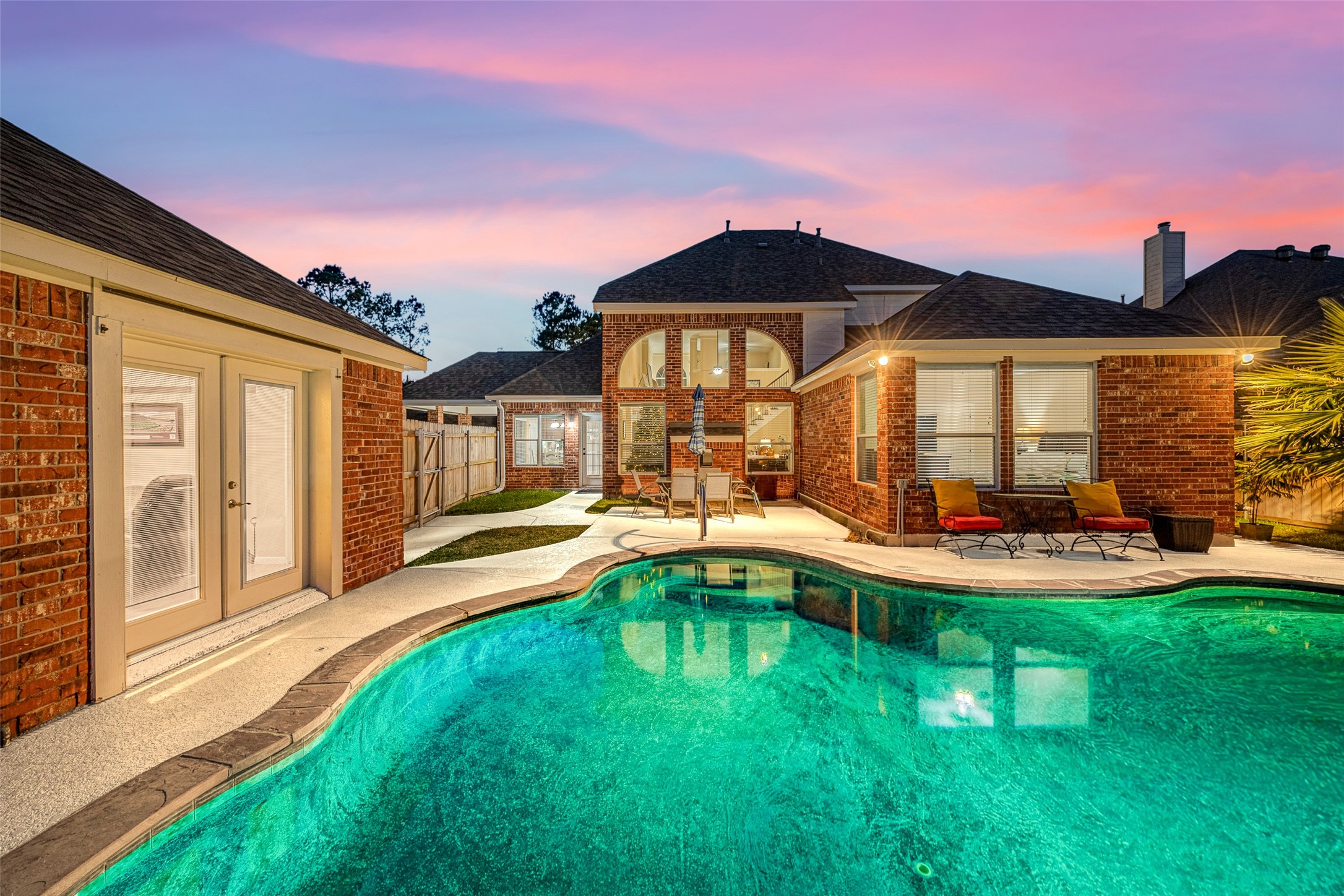 1905 Rosenbaum Drive Brenham, TX 77833 - Photo 4 of 30 a front view of a house with swimming pool having outdoor seating