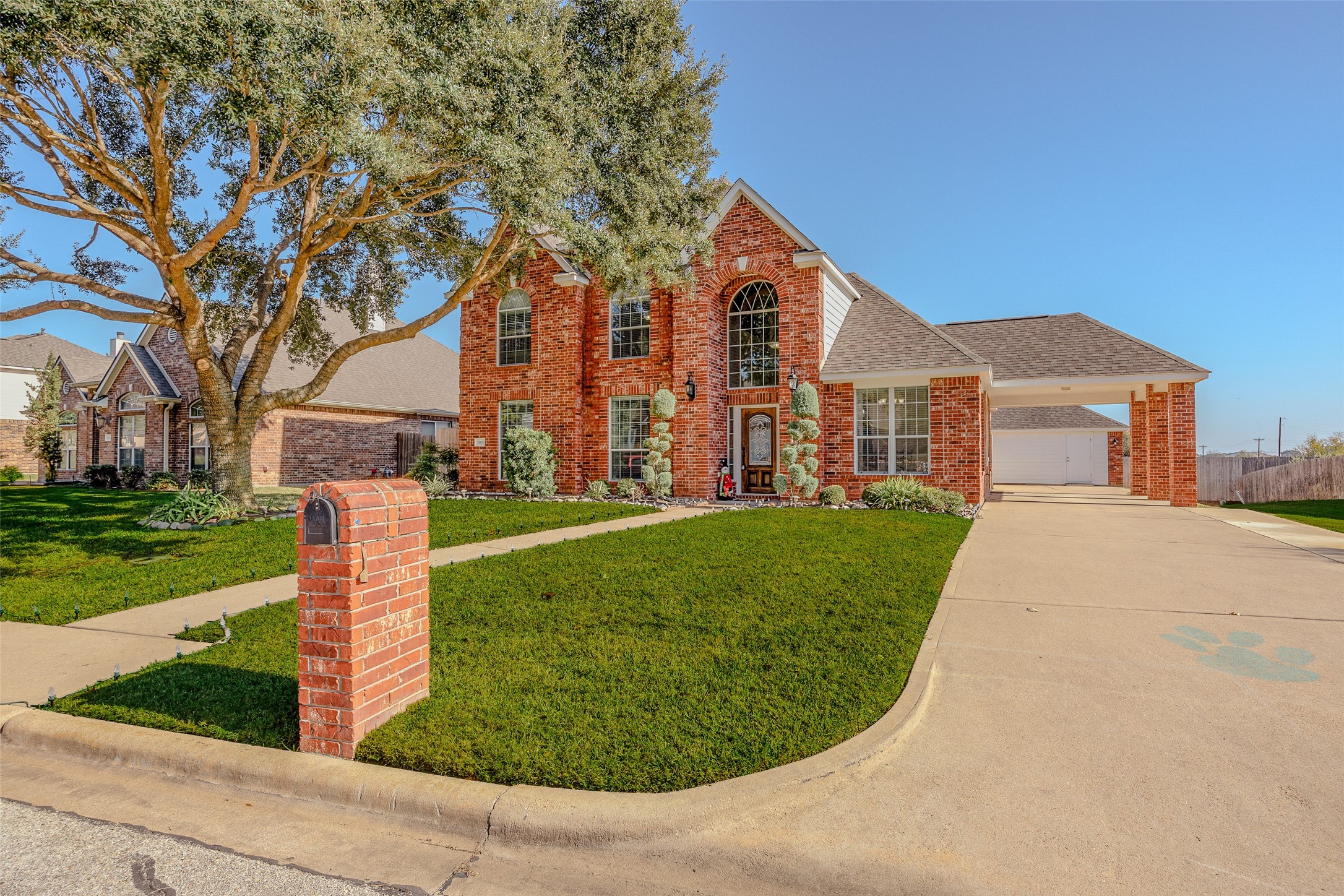 1905 Rosenbaum Drive Brenham, TX 77833 - Photo 5 of 30 a front view of a house with a yard and green space