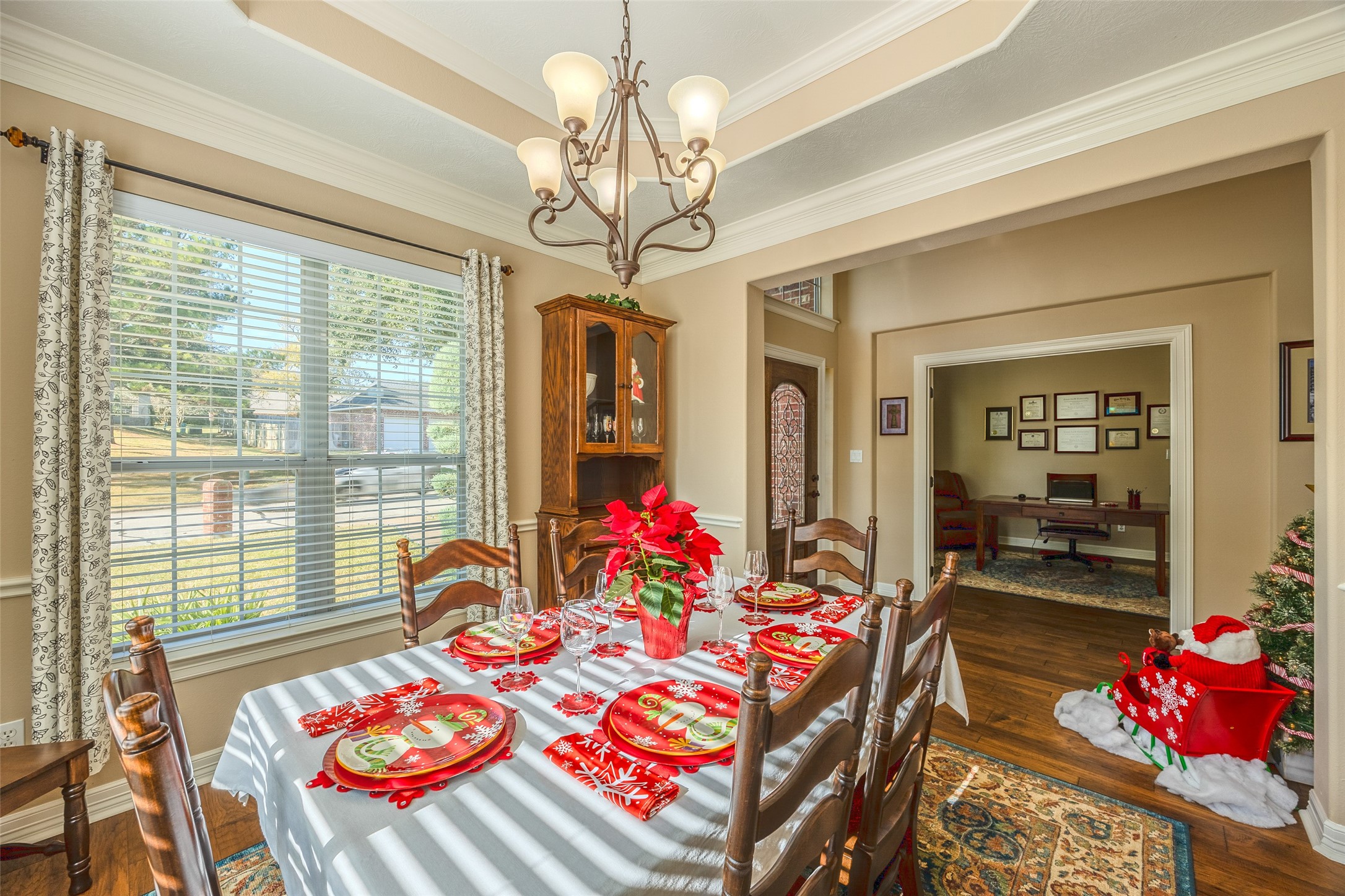 1905 Rosenbaum Drive Brenham, TX 77833 - Photo 9 of 30 a front view of a dining room with furniture a chandelier and large windows