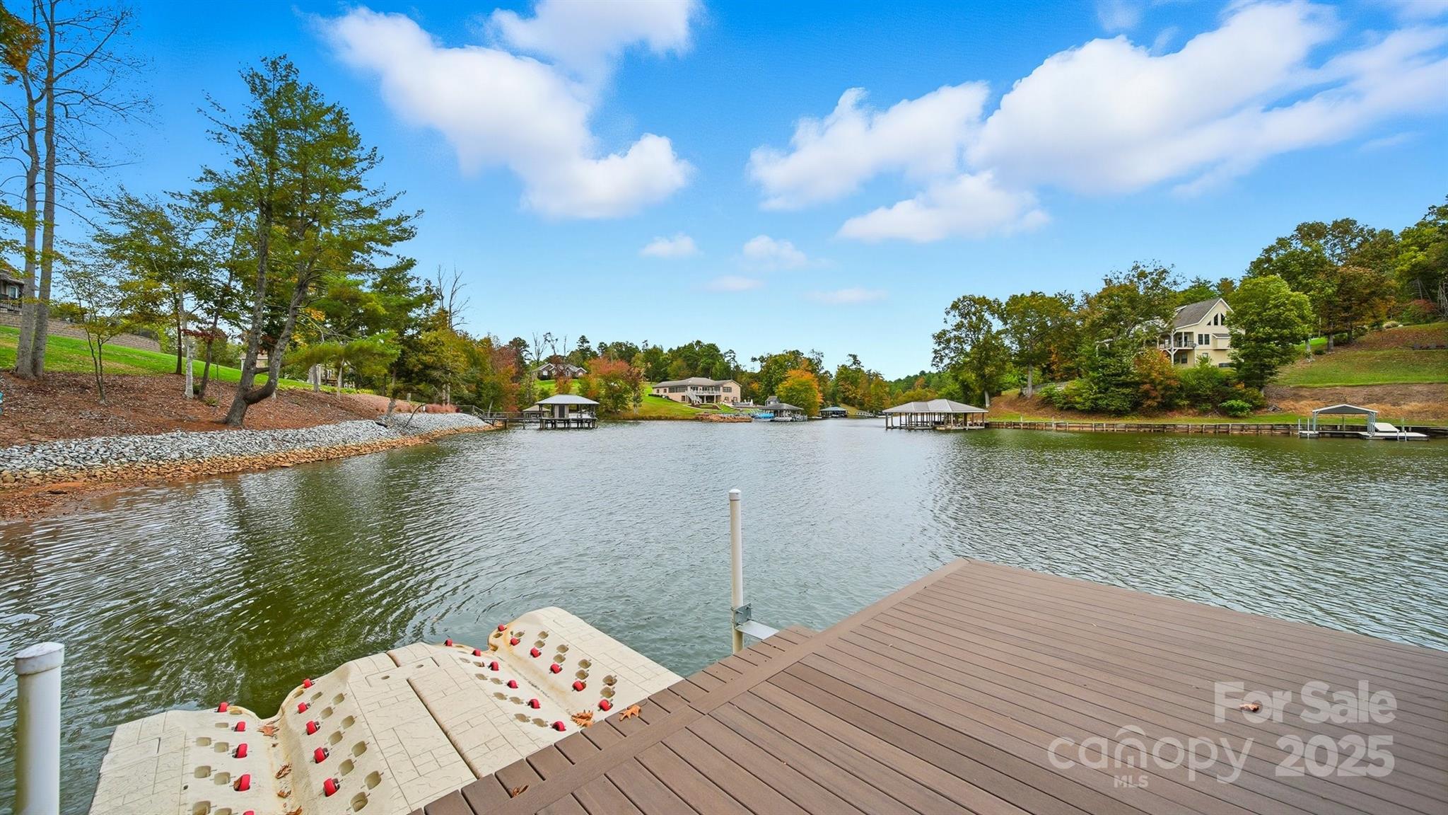 5411 Icard Ridge Road Hickory, NC 28601 - Photo 15 of 26 a wooden bench sitting next to a lake