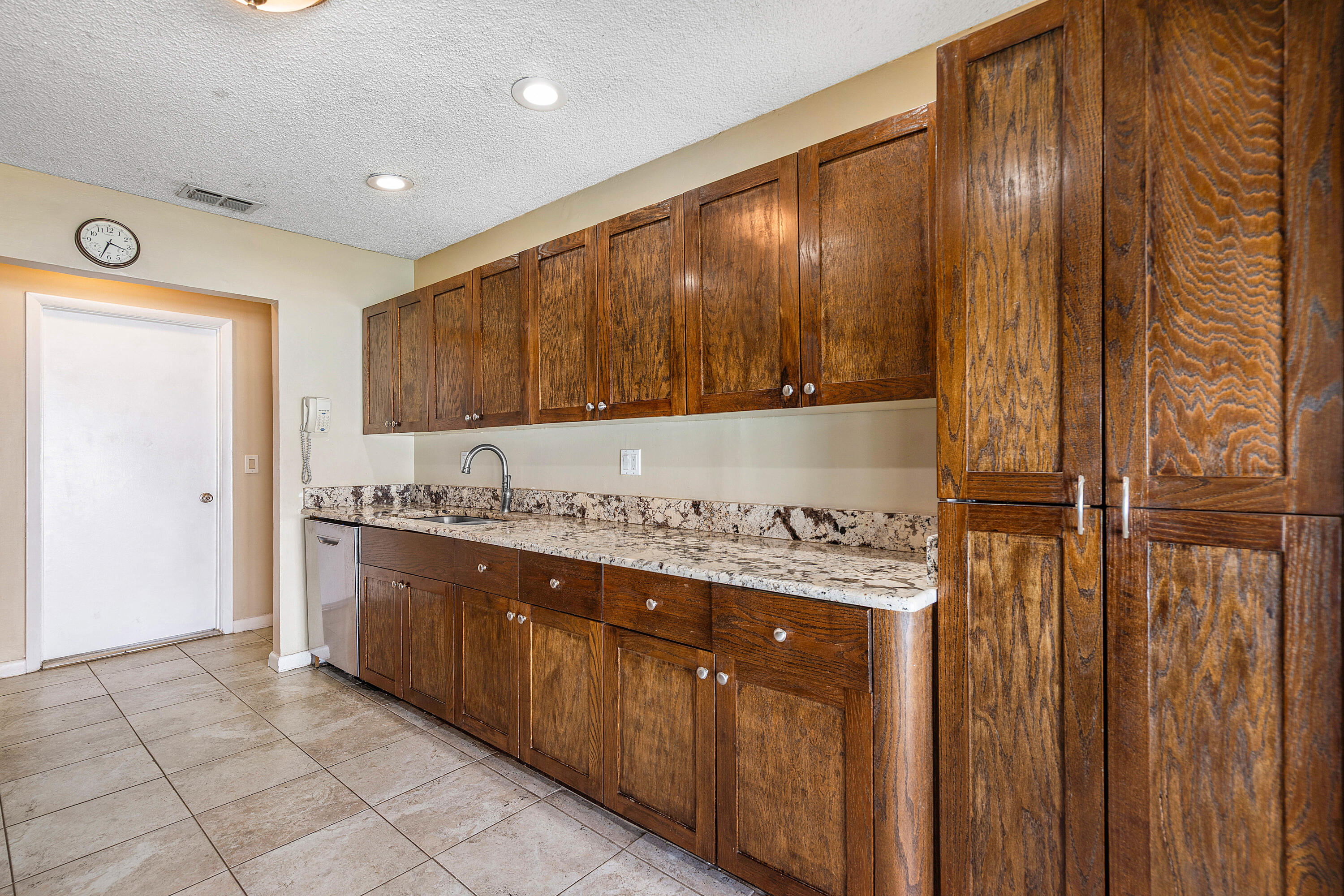 21212 Escondido Way Boca Raton, FL 33433 - Photo 11 of 48 a kitchen with stainless steel appliances granite countertop a refrigerator and a stove