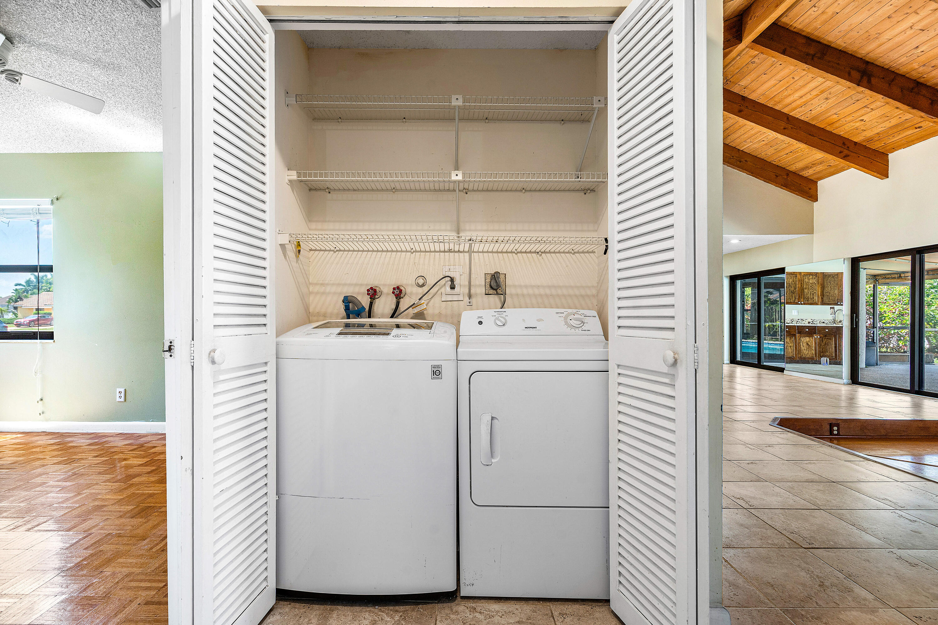 21212 Escondido Way Boca Raton, FL 33433 - Photo 26 of 48 a utility room with closet dryer and washer