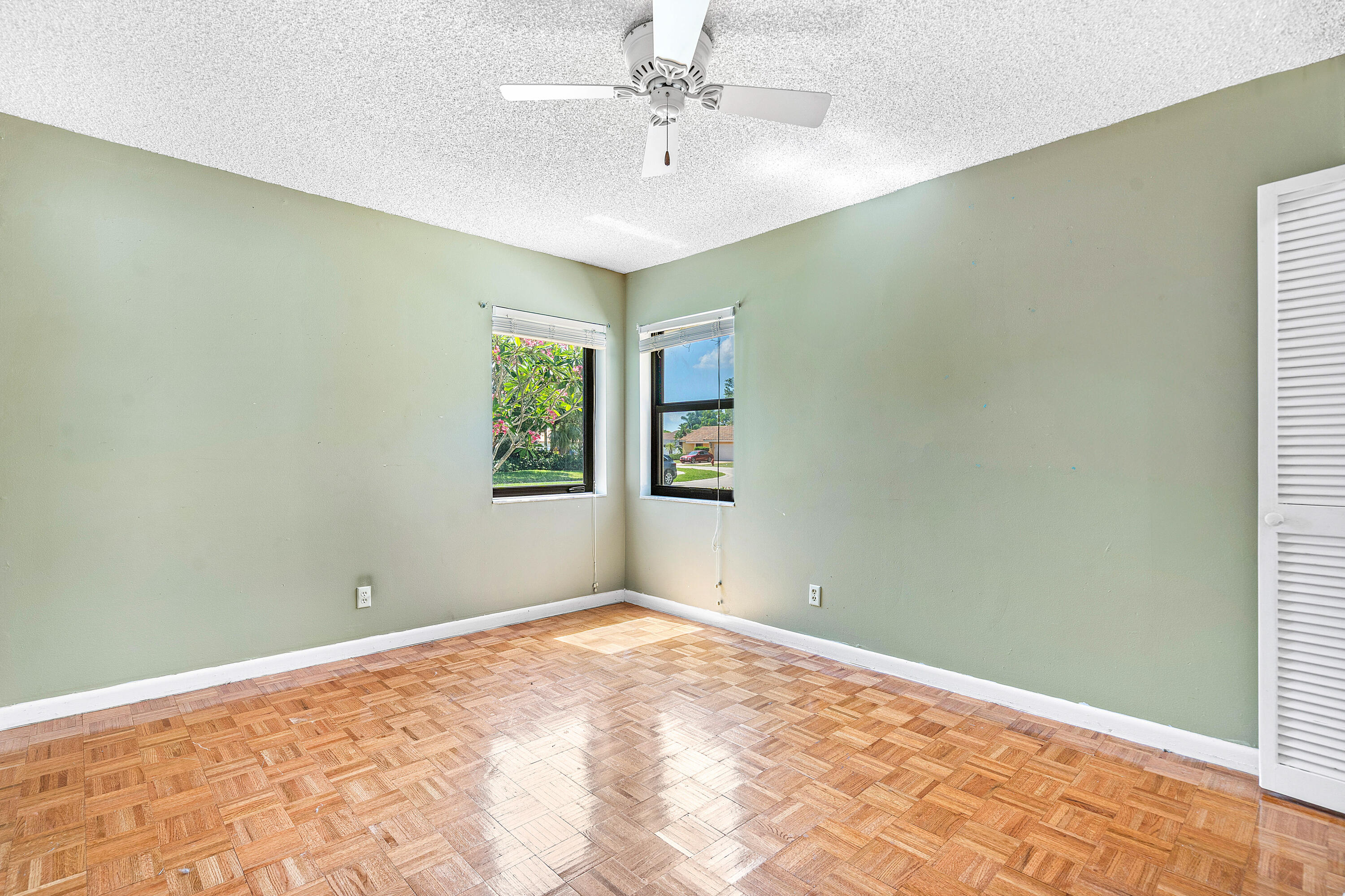 21212 Escondido Way Boca Raton, FL 33433 - Photo 27 of 48 a view of a big room with windows and chandelier fan