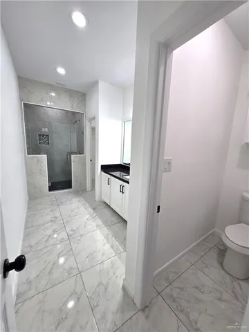 a bathroom with a sink and toilet