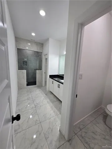 a view of a storage & utility room with a sink