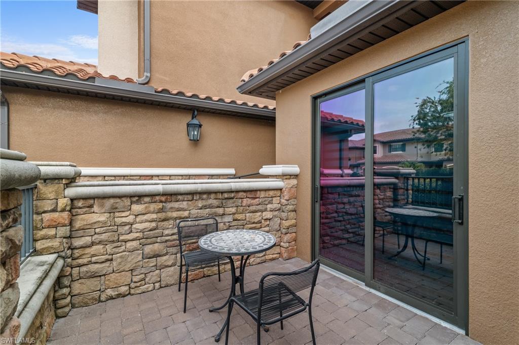 9637 Montelanico Loop, Unit 104 Naples, FL 34119 - Photo 22 of 45 View of patio