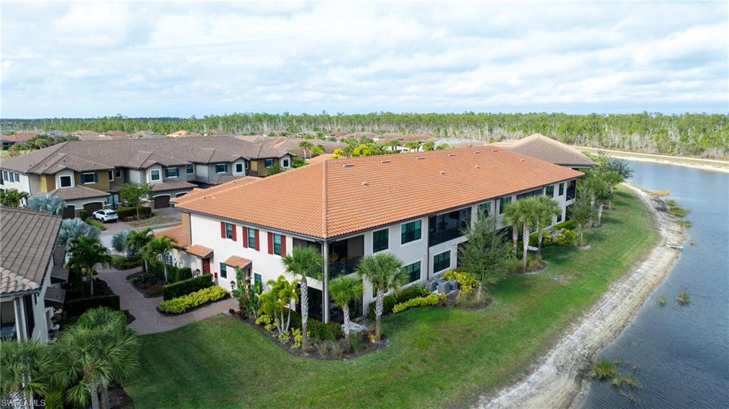 9637 Montelanico Loop, Unit 104 Naples, FL 34119 - Photo 27 of 45 Aerial perspective of suburban area