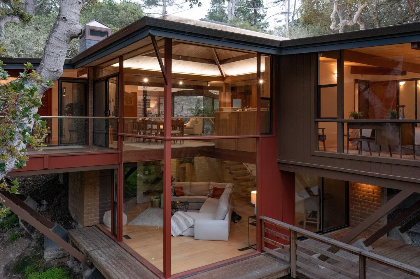 a backyard of a house with barbeque oven and outdoor seating
