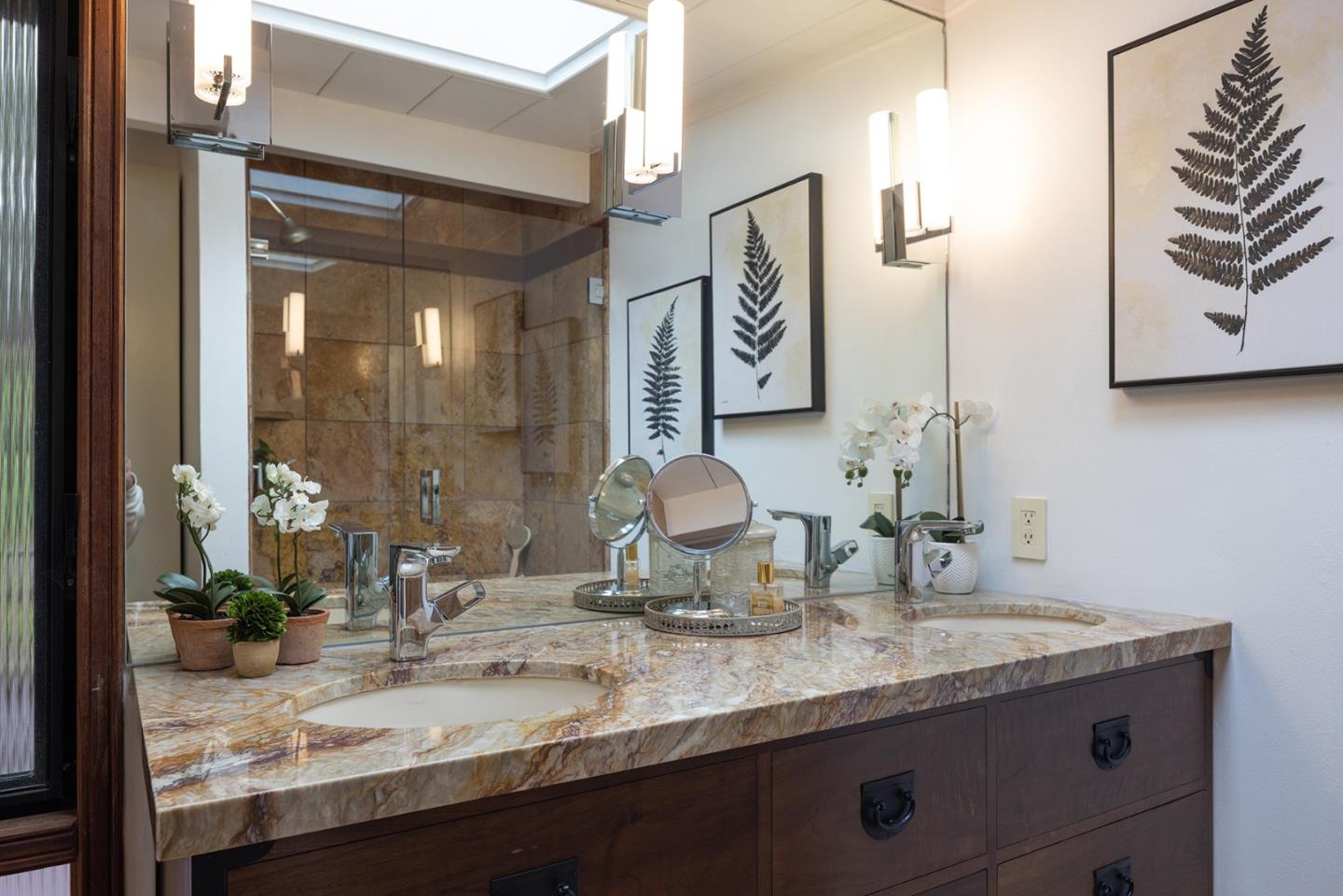 4145 Segunda Drive Carmel, CA 93923 - Photo 13 of 30 a bathroom with a granite countertop sink and a mirror
