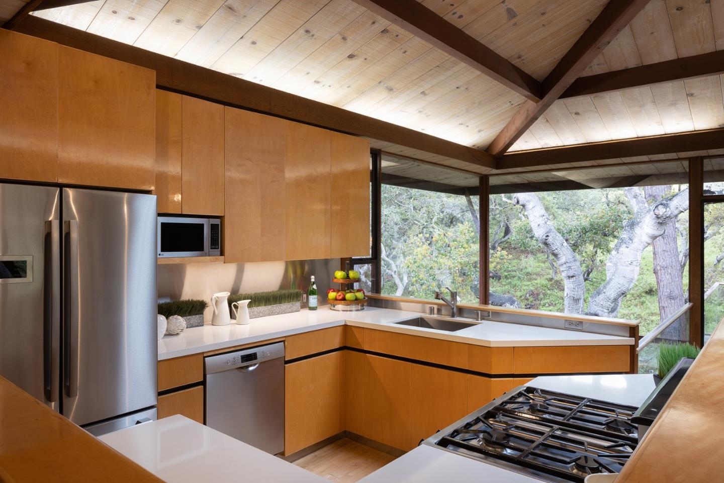 4145 Segunda Drive Carmel, CA 93923 - Photo 8 of 30 a kitchen with stainless steel appliances granite countertop a sink a stove and a refrigerator