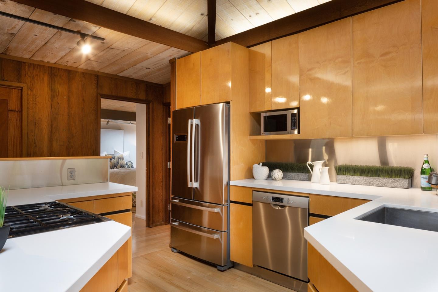 4145 Segunda Drive Carmel, CA 93923 - Photo 9 of 30 a kitchen with stainless steel appliances a refrigerator sink and microwave