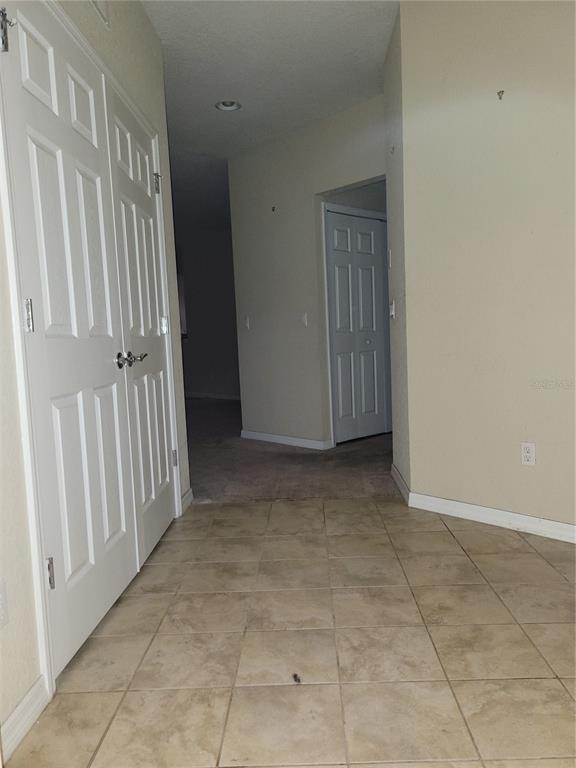 8335 Bella Vida Circle, Unit 8335 Davenport, FL 33896 - Photo 13 of 16 a view of an empty room with a window