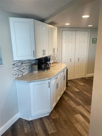 a kitchen with a sink and cabinets