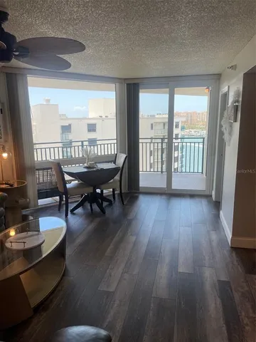 a dining room with furniture window and wooden floor