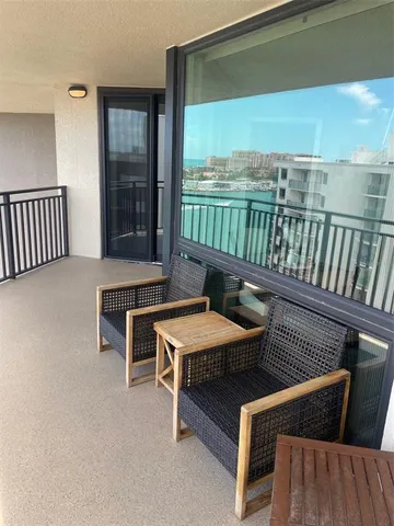 a reading room with furniture and a large window