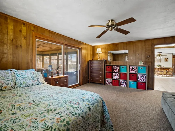 a bedroom with a bed closet and flowerpot
