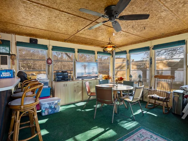a outdoor space with a large window and furniture