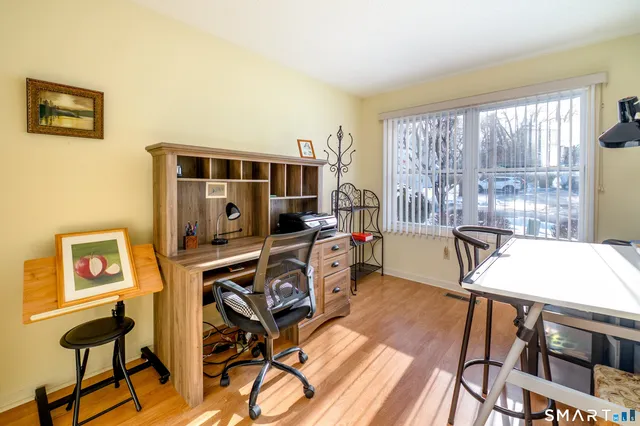 a view of a livingroom with furniture and a flat screen tv