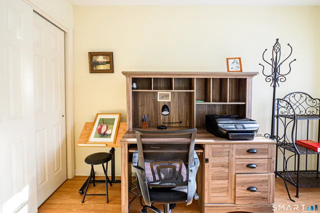a view of a livingroom with furniture and a fireplace