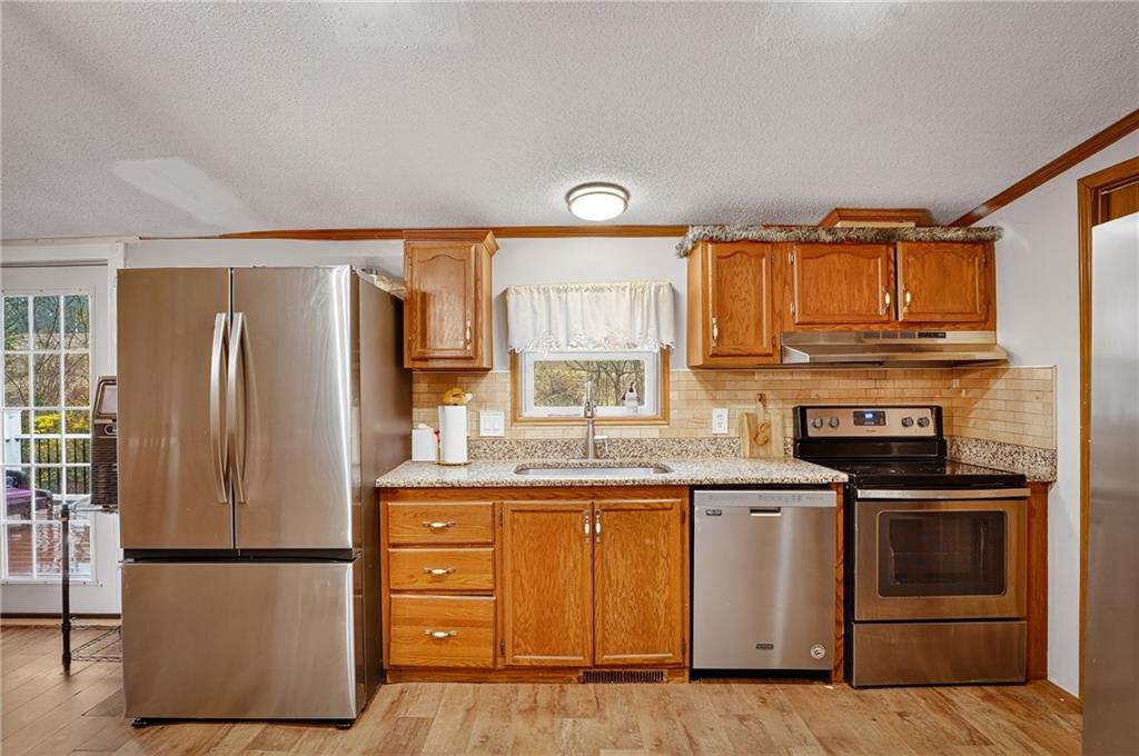 90 Hornhead Road McDonald, PA 15057 - Photo 14 of 33 a kitchen with a stove a refrigerator and a sink