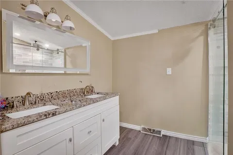 a bathroom with a sink a vanity and mirror