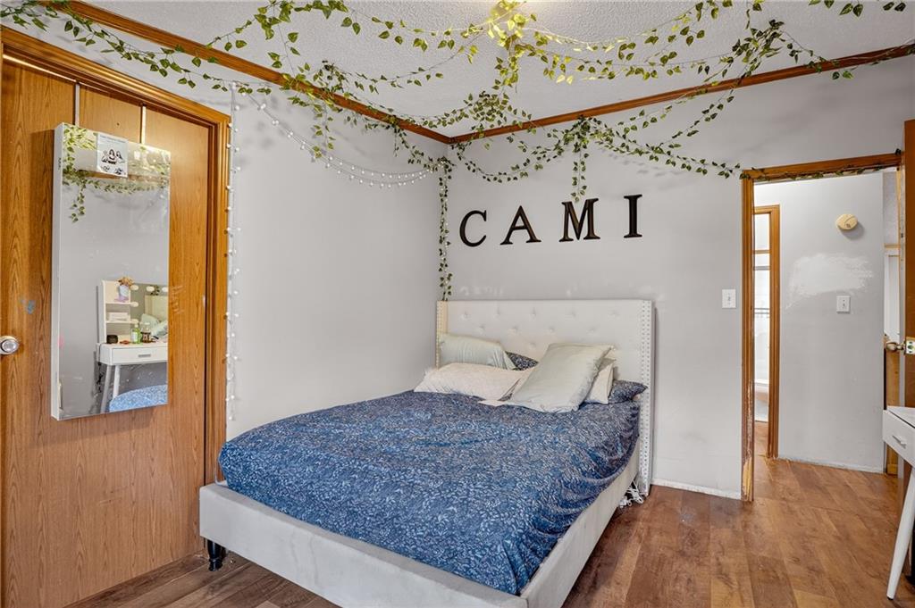 90 Hornhead Road McDonald, PA 15057 - Photo 19 of 33 a bedroom with a large bed and a wooden floor