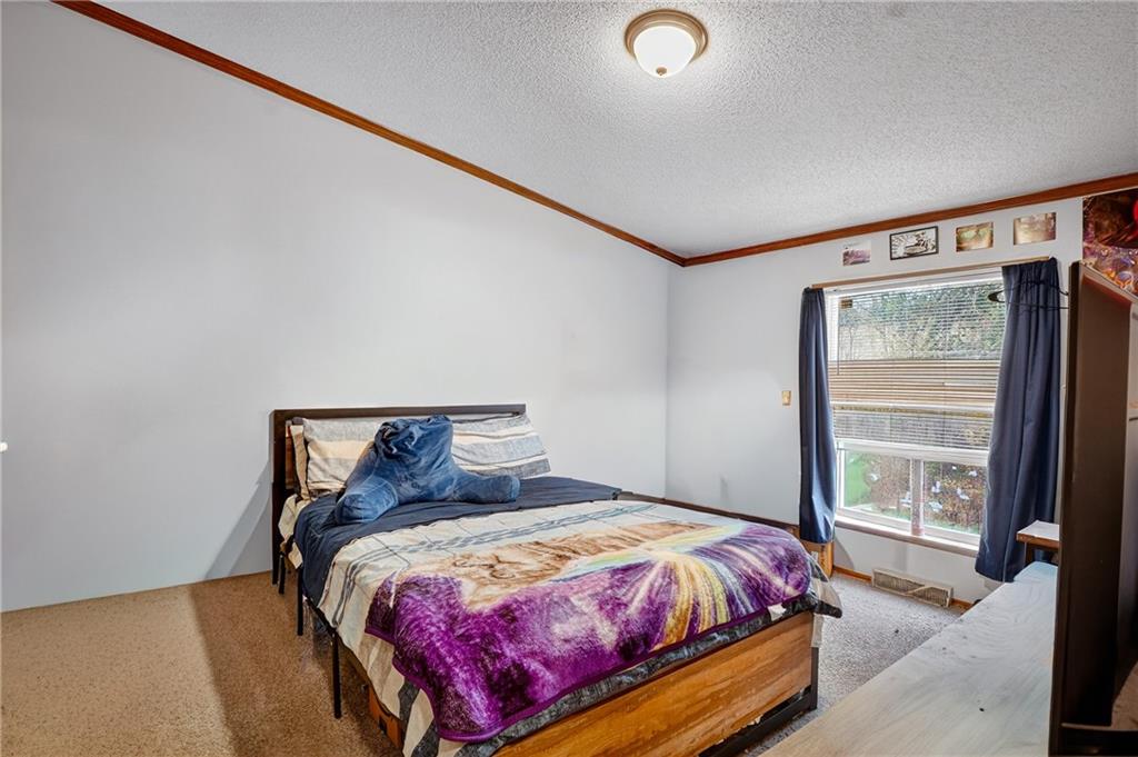 90 Hornhead Road McDonald, PA 15057 - Photo 20 of 33 a bed sitting in a bedroom next to a window