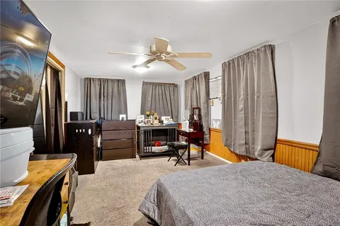 a bedroom with a bed and furniture