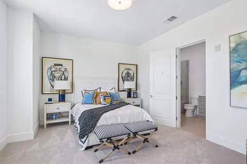 a bedroom with furniture and window