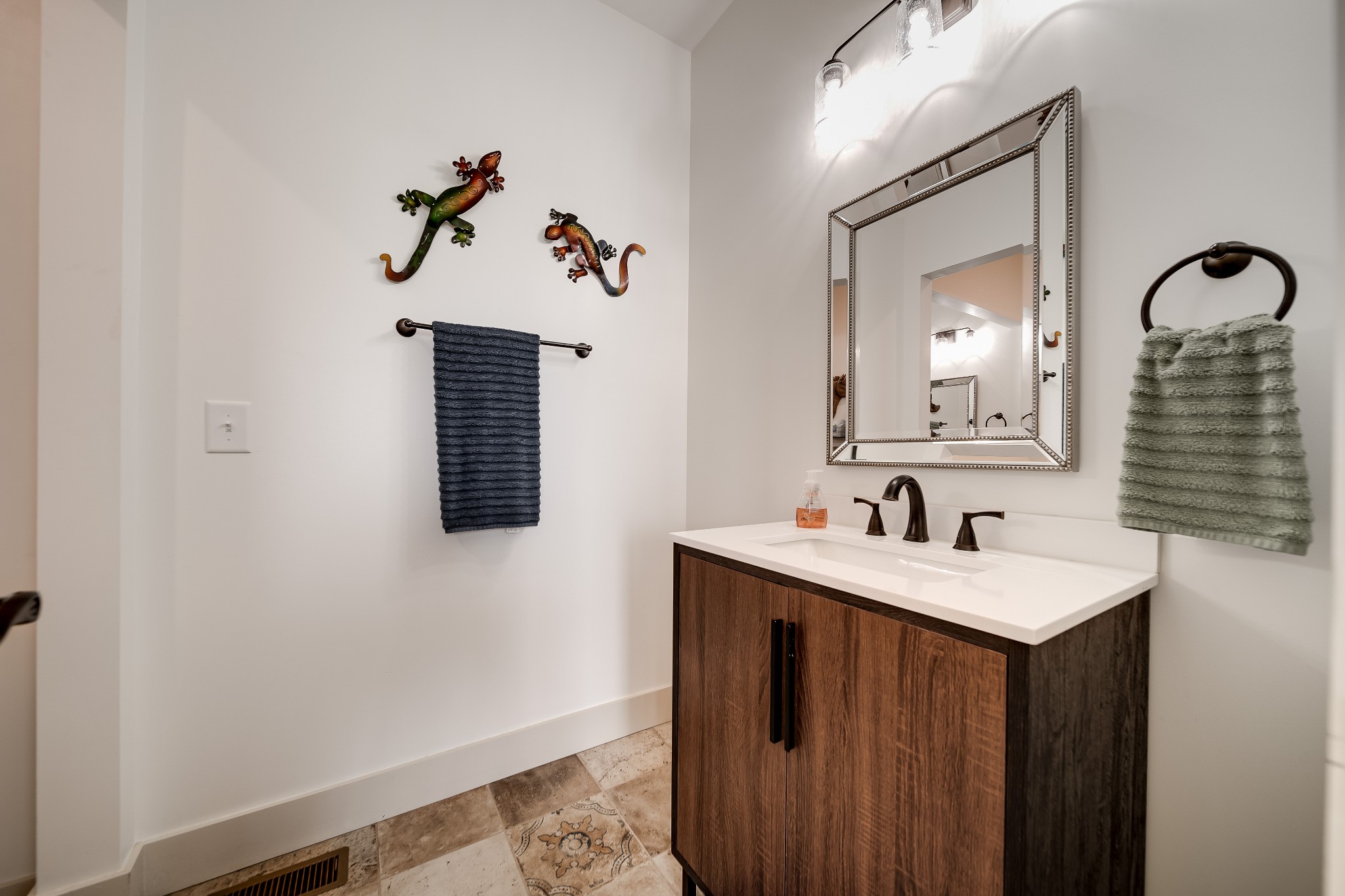 7040 Highway 231 Bethpage, TN 37022 - Photo 19 of 83 a bathroom with a sink vanity and mirror