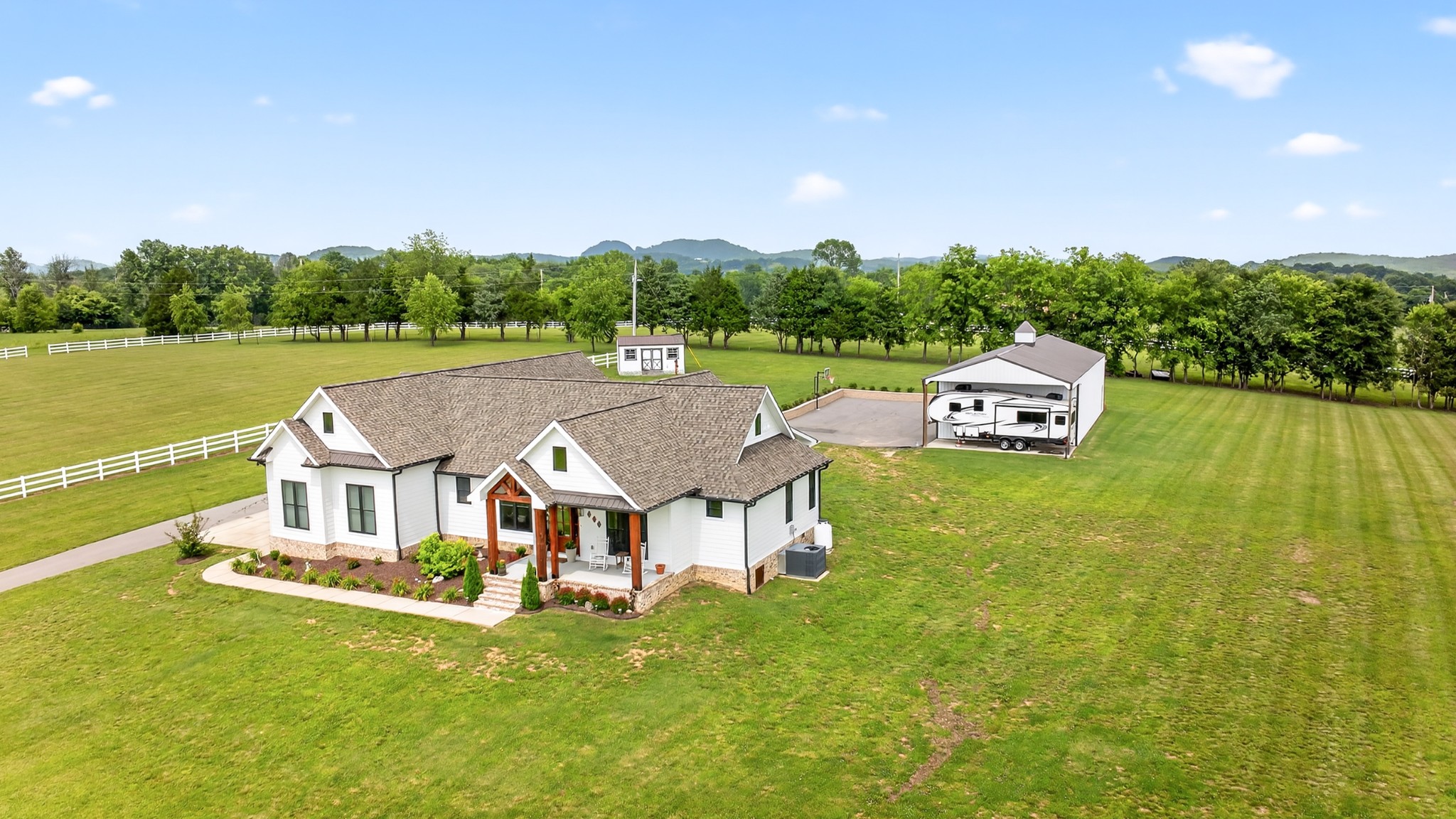 7040 Highway 231 Bethpage, TN 37022 - Photo 2 of 83 a aerial view of a house with swimming pool garden and outdoor seating