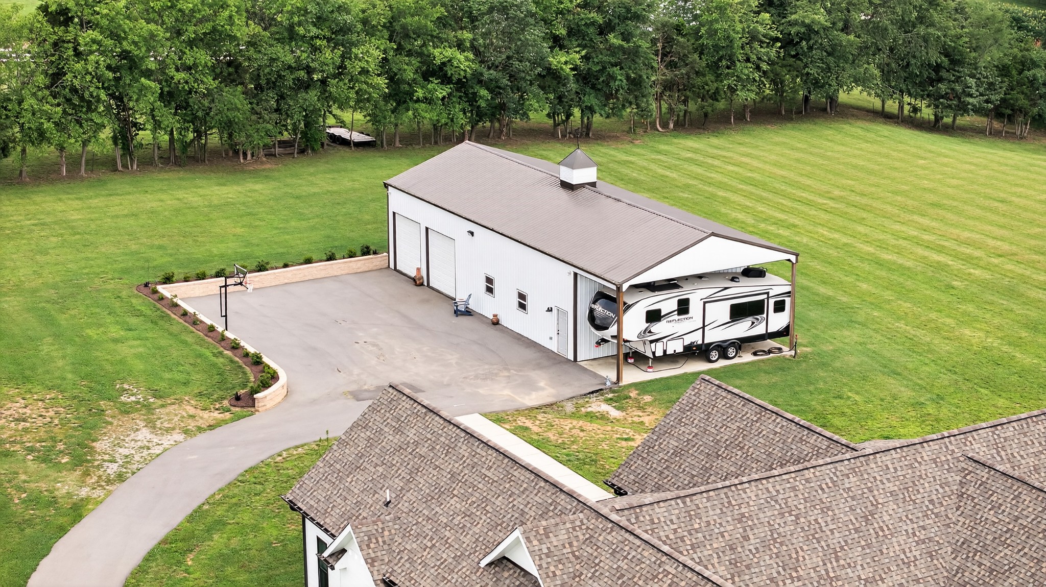 7040 Highway 231 Bethpage, TN 37022 - Photo 55 of 83 an aerial view of a house having yard